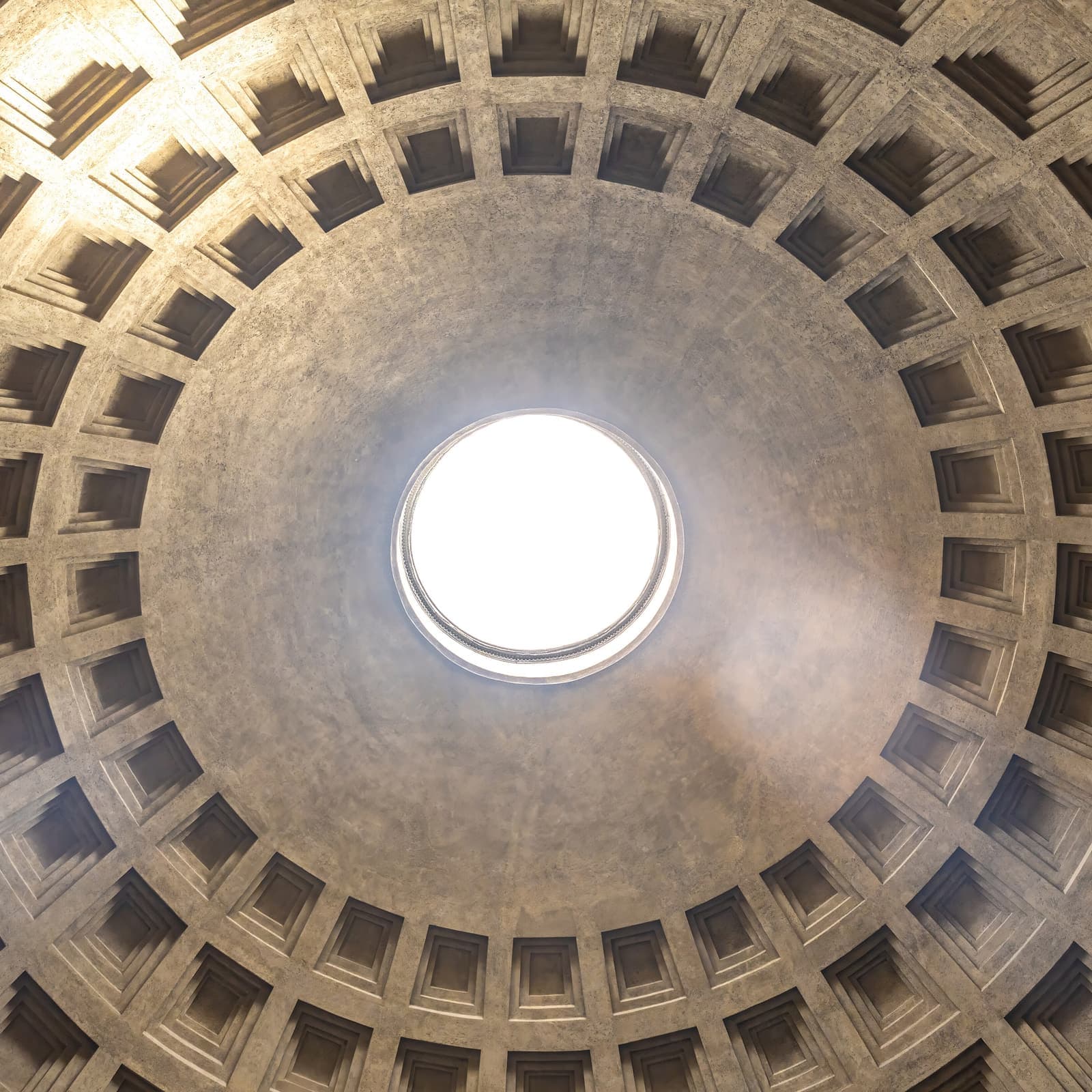 The coffered concrete dome of the Pantheon seen from directly below, with daylight falling through the oculus.